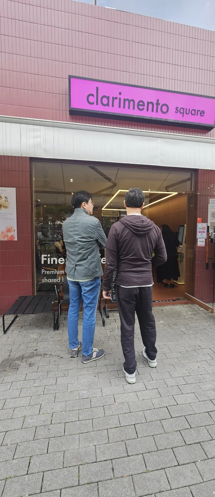 The entrance under the pink sign