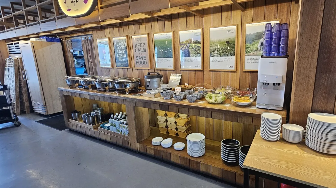The food corner — a row of warming pots and rice cookers