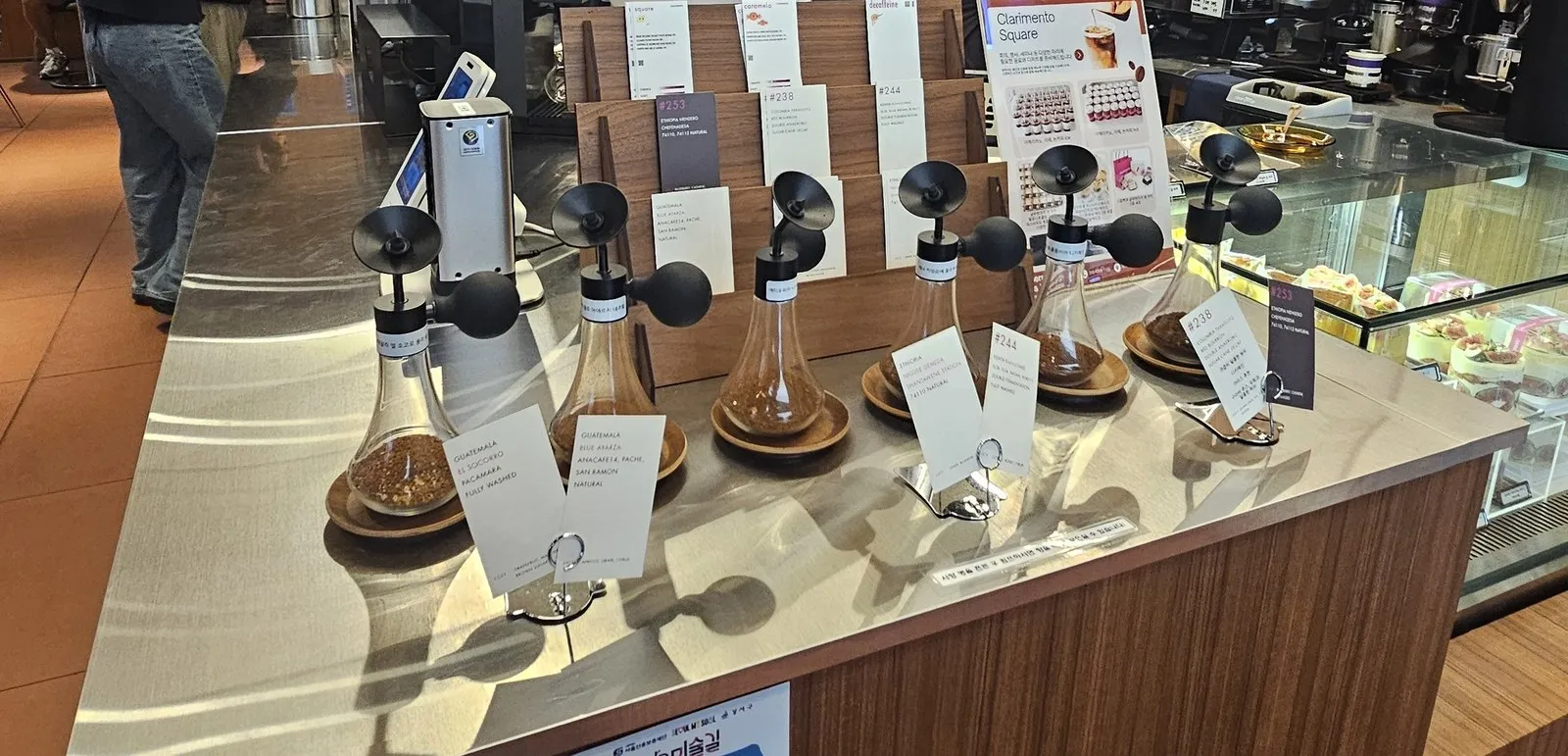 Bean sniffing jars and bean cards on the counter