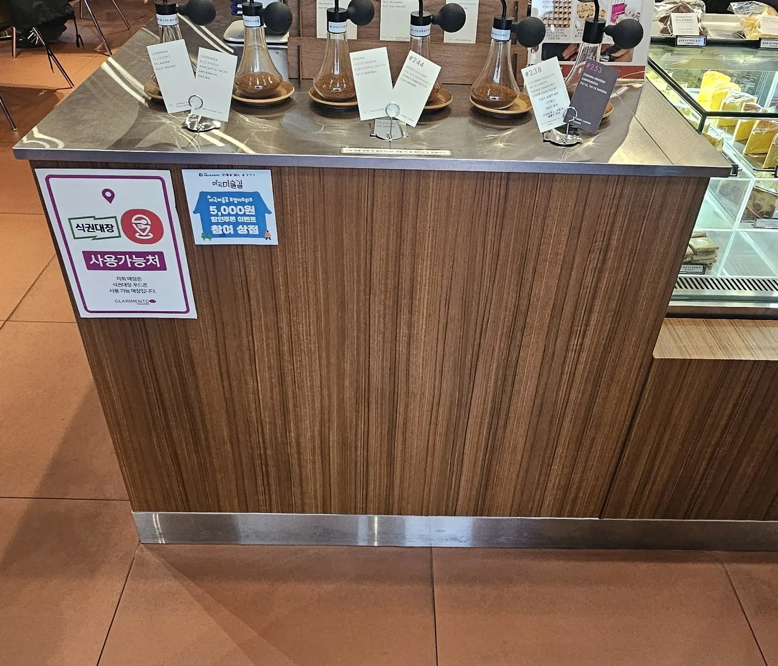 In front of the sniffing counter — Meal Ticket Daejang and Magok Misul-gil notices