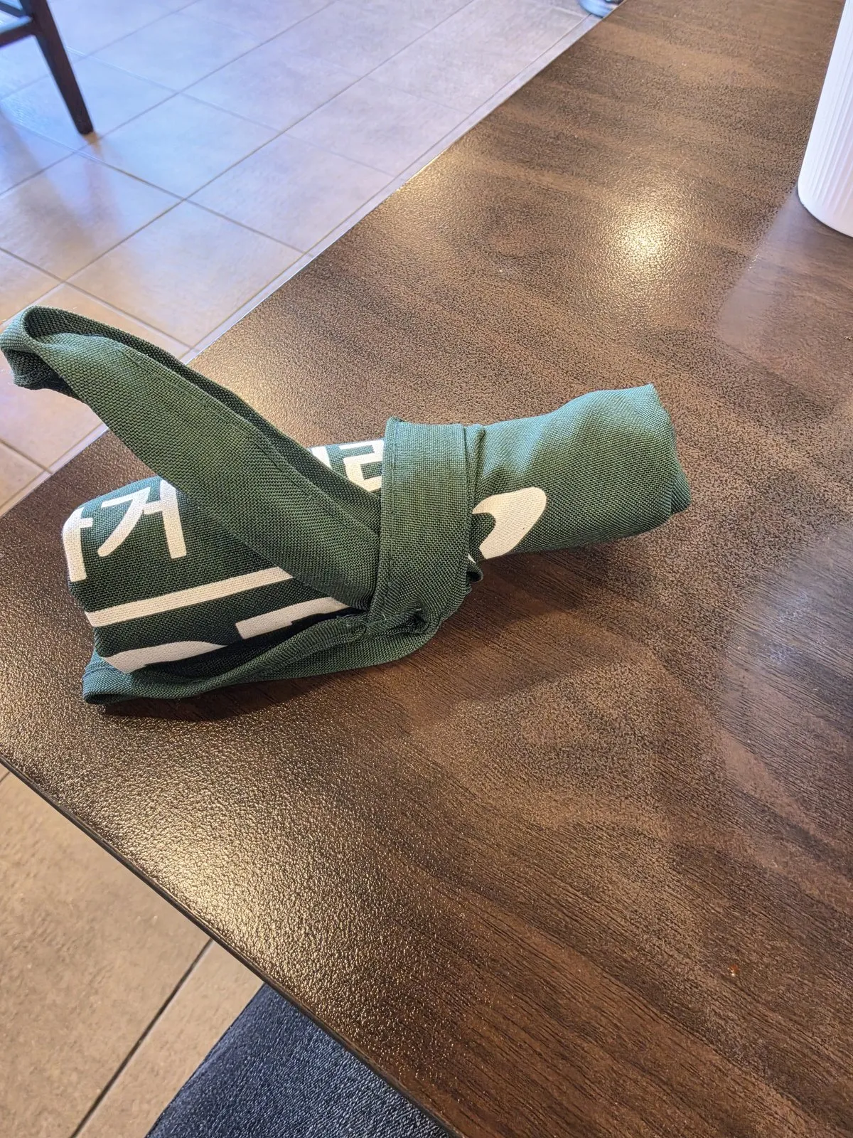 The green apron the owner brought